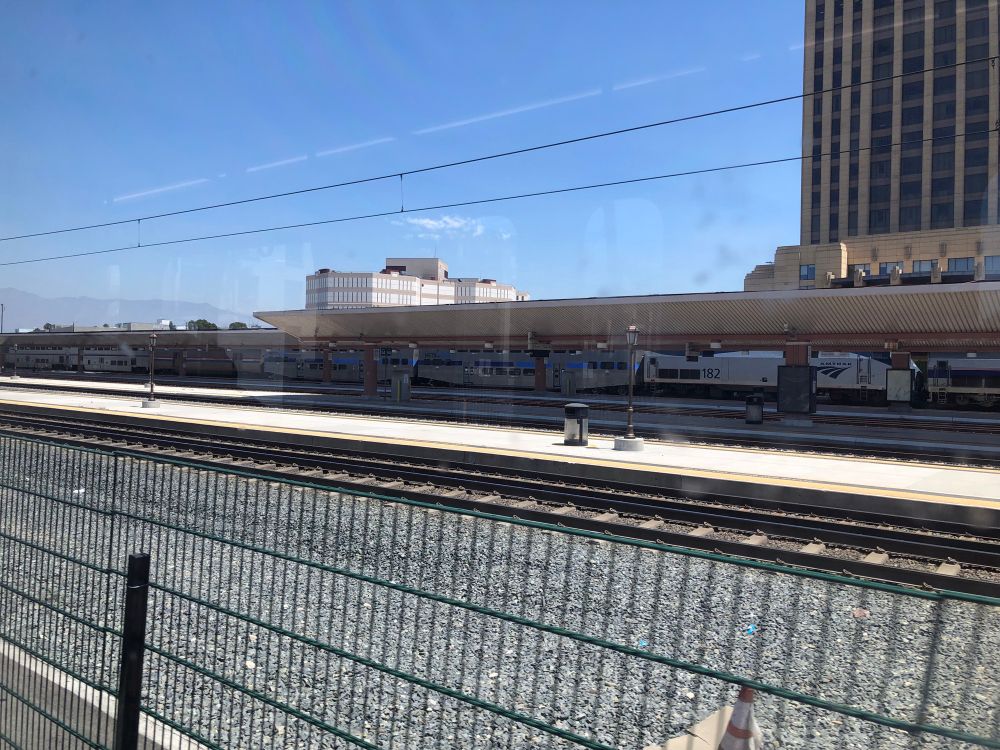 Amtrak train with three metrolink bilevels at the end (not in photo: 3 Genesis locomotives, one of which with a phase 3 livery)