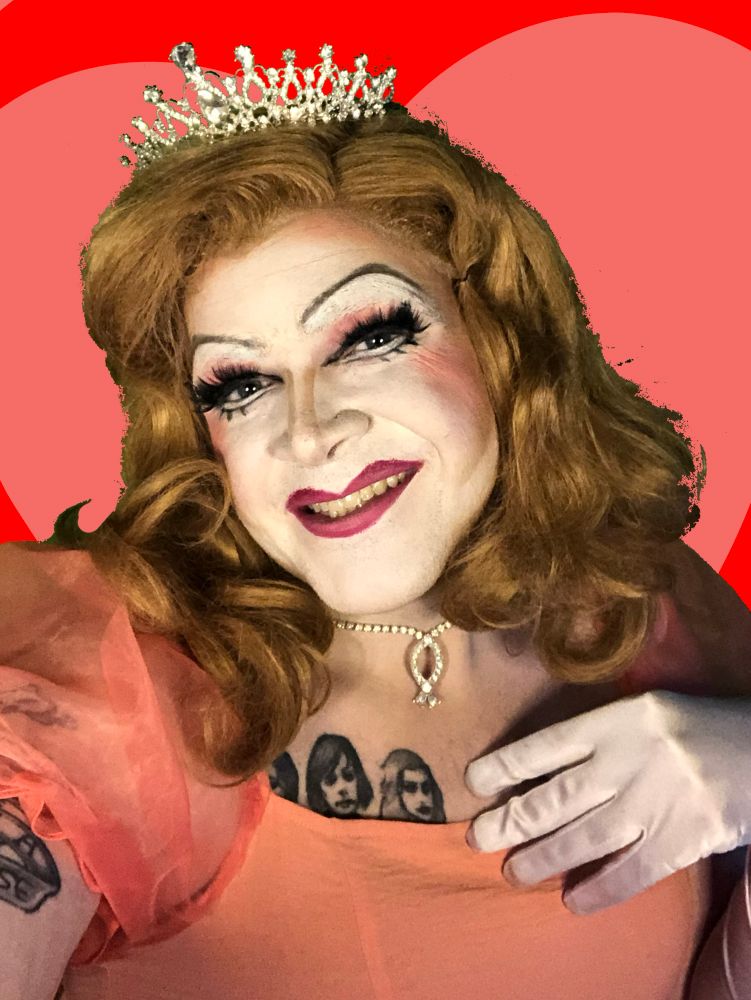 Kitten Tiramisu wearing a tiara with white gloves and a pink dress with puffy sleeves