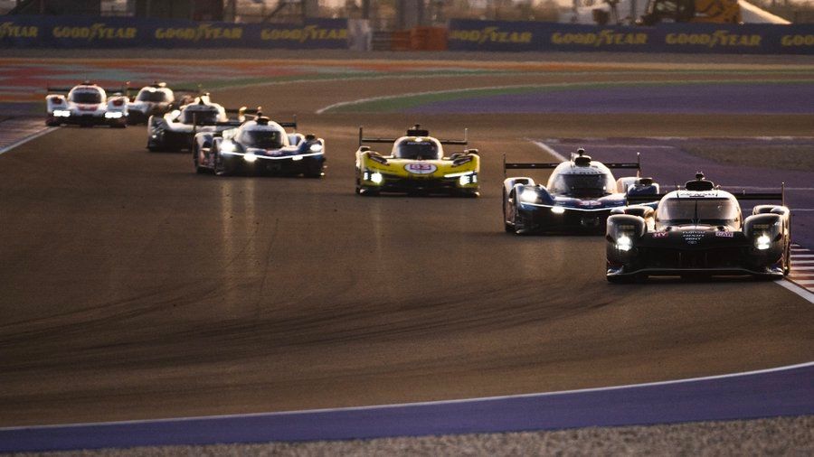 Various Hypercars at Qatar's Losail International Circuit for the FIA WEC Prologue, in fading sunlight.