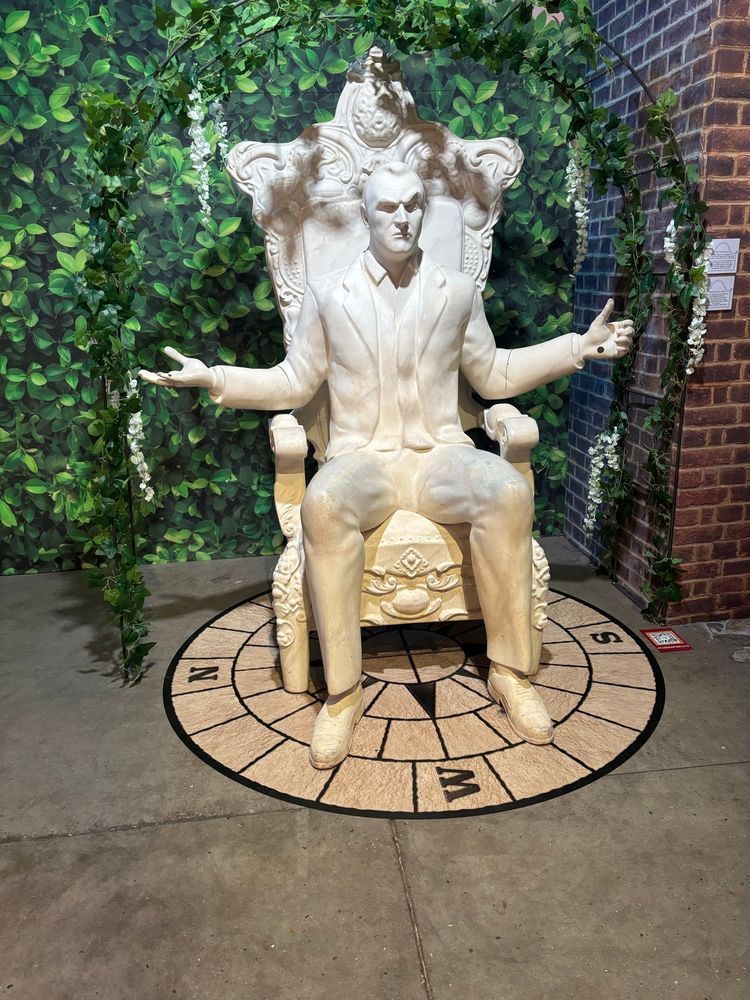 A poly composite model of Greg Davies with his arms outstretched