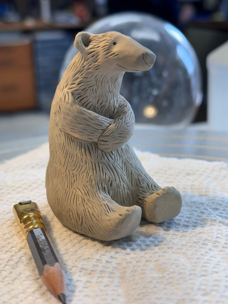 A miniature clay polar bear made of porcelain. 