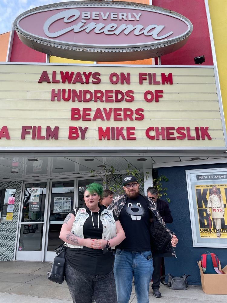 BJ Colangelo and Justin Cook outside of the marquee at the New Beverly for Hundreds of Beavers.