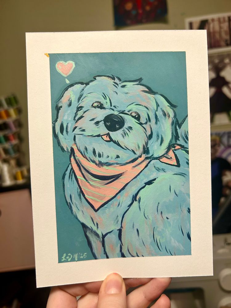 A person holding a painting of a white dog with a peach bandanna. 
