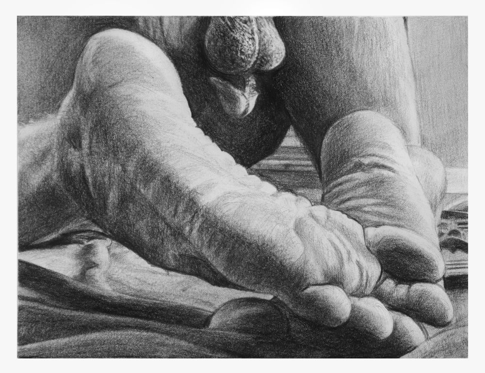 closeup B&W image of male body in downward dog type pose, viewed from the feet.