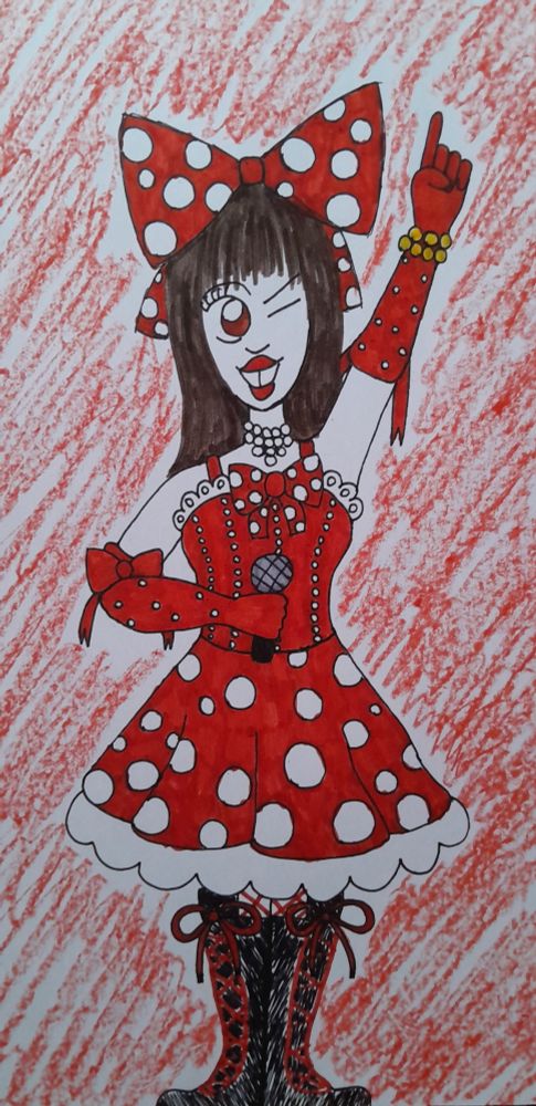 Arte que fiz da cantora Yoko Hamasaki vocalista do grupo urbangarde 
Yoko tem cabelo comprido castanho usa um laço grande na cabeça de cor vermelha com bolinhas brancas um colar de pérolas um vestido vermelho com bolinhas brancas babados fitas e pequenas pedrinhas brilhantes além de também usar botas de cano longo com cadarços vermelhos 