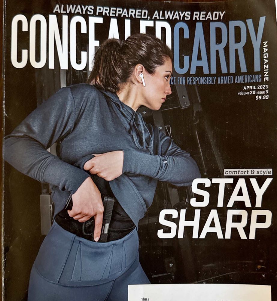 This is the cover of a magazine called concealed carry. It features a photograph of a woman drawing a pistol from under a  sweatshirt.