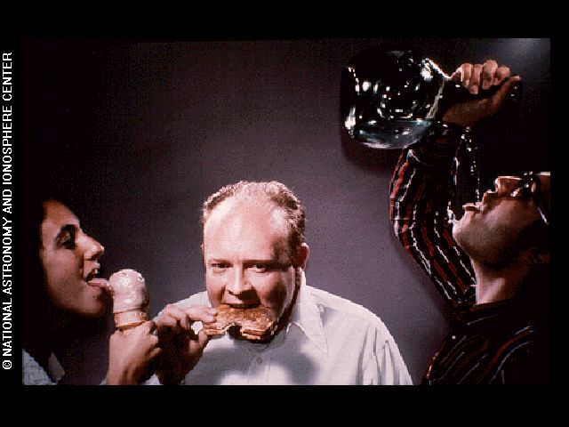 The demonstration of licking, eating and drinking image is one of the pictures electronically placed on the phonograph records which are carried onboard the Voyager 1 and 2 spacecraft.