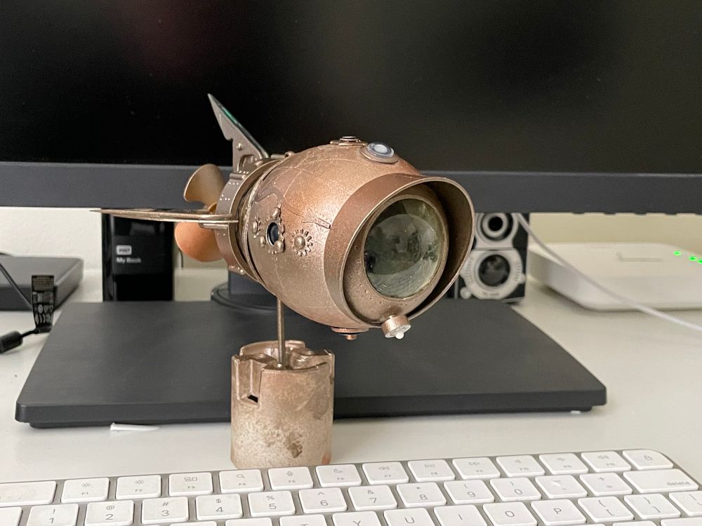 Miniature steampunk submarine model, 3/4 front view.