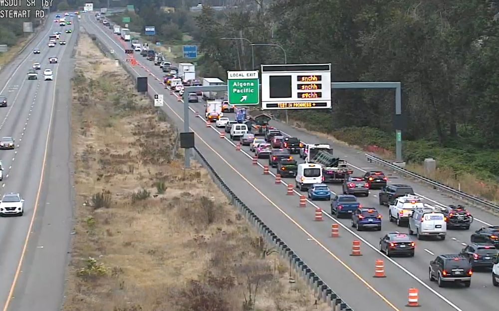 A camera image showing northbound SR 167 where the two left lanes are closed after a bridge strike near Pacific / Algona. 