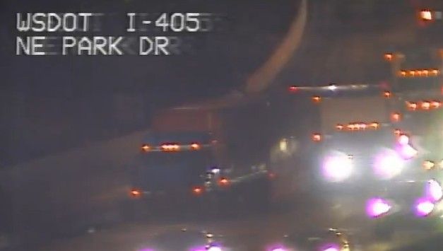 A photo showing a semi blocking the right lane