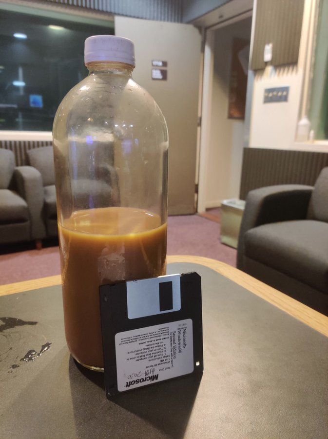 Reference photo for "Still Life With Irresponsibly Large Cold Brew Coffee Jar & Windows 98 Boot Disk".