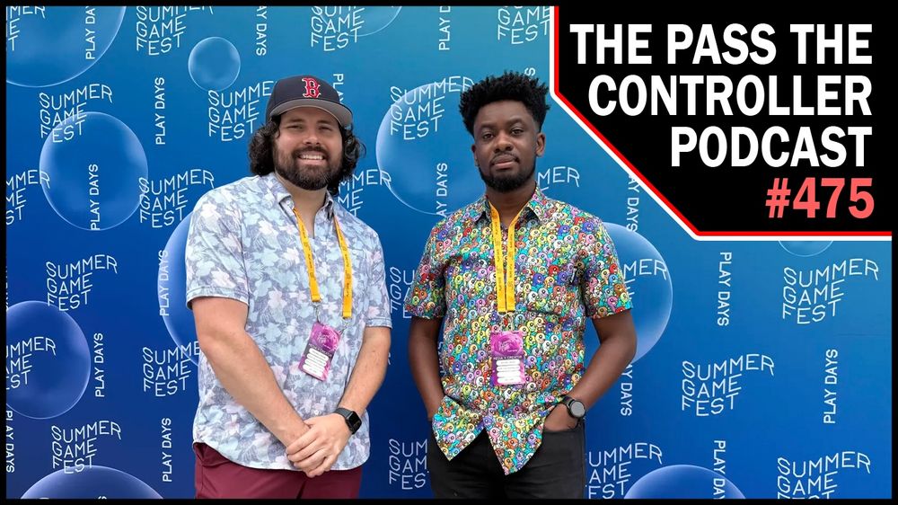 Brenden and Michael standing in front of a Summer Game Fest banner 