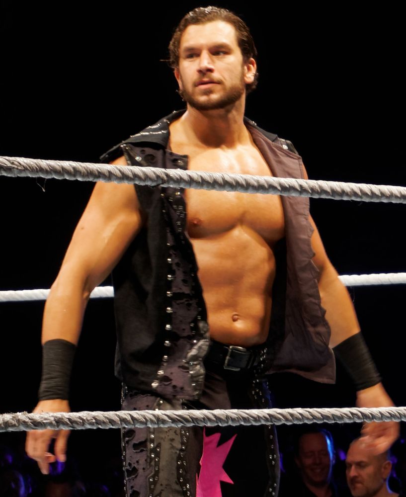 pro wrestler Fandango wearing a vest, leather pants, nothing else