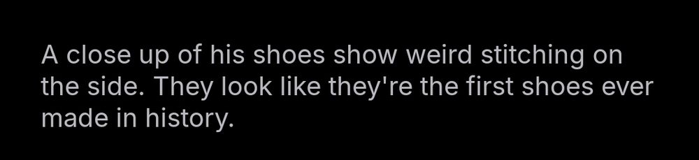 Image of Alt text reading "A close up of his shoes show weird stitching on the side.  They look like they're the first shoes ever made in history."