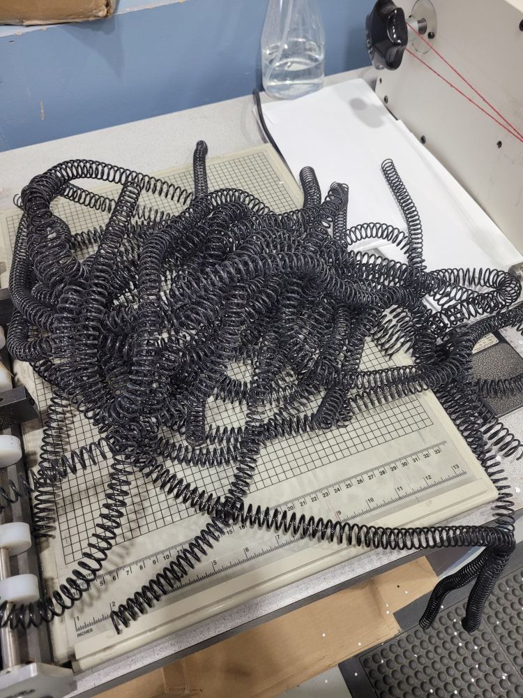 A tangled mess of bindery coils.