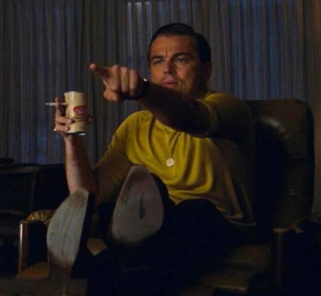 Meme of Leo DiCaprio pointing at the screen while holding a beer and a cigarette.