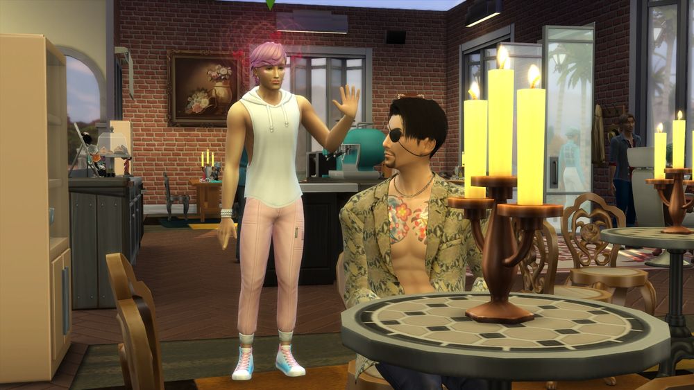 A screenshot from the sims 4. A pink haired sim in the background waves  as hearts float around his head towards a sim sitting by a table in the foreground. The other sim looks like Goro Majima from Yakuza.