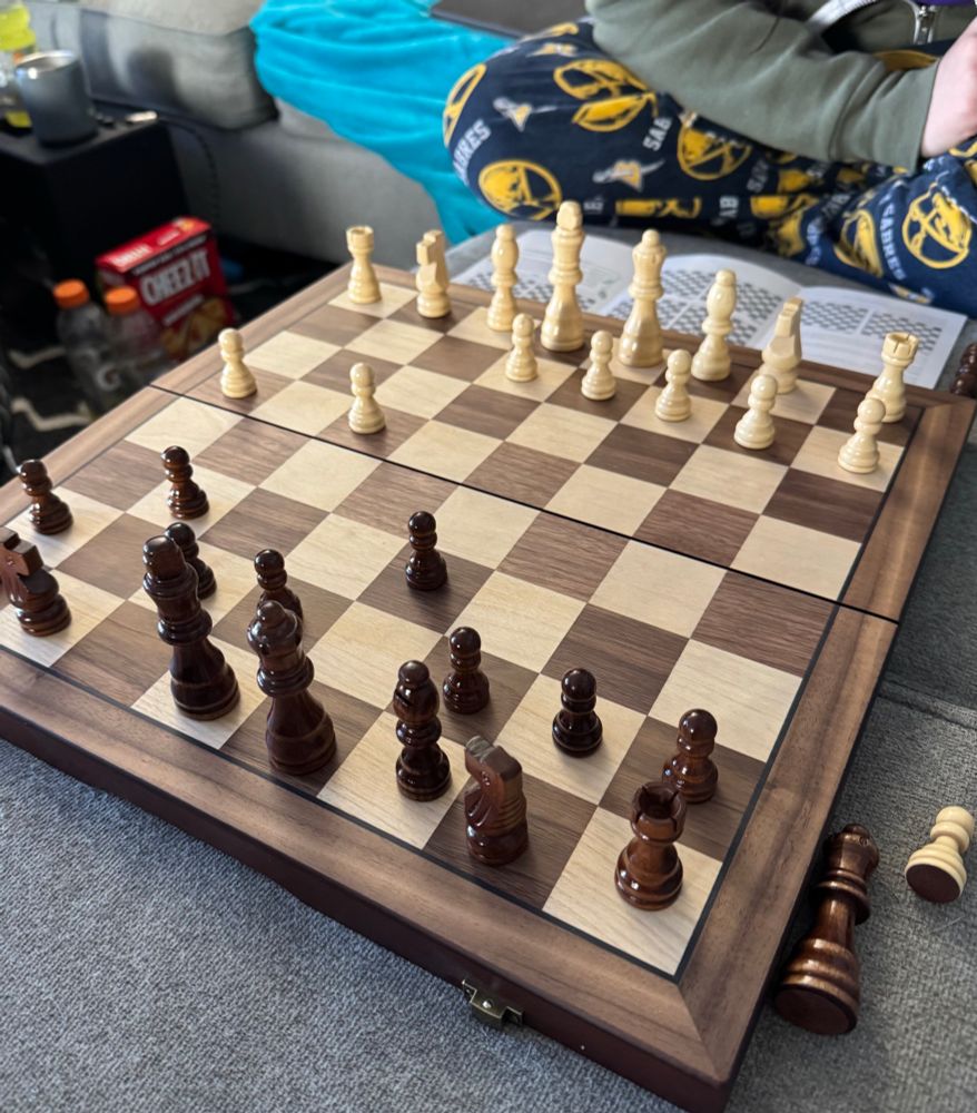 chess board. emotional support gatorades in background with cheezits box