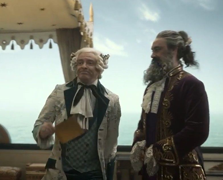 A scene from Our Flag Means Death 1x5, Ed is gazing at Stede with heart eyes while Stede stands next to him just as they are boarding the French ship