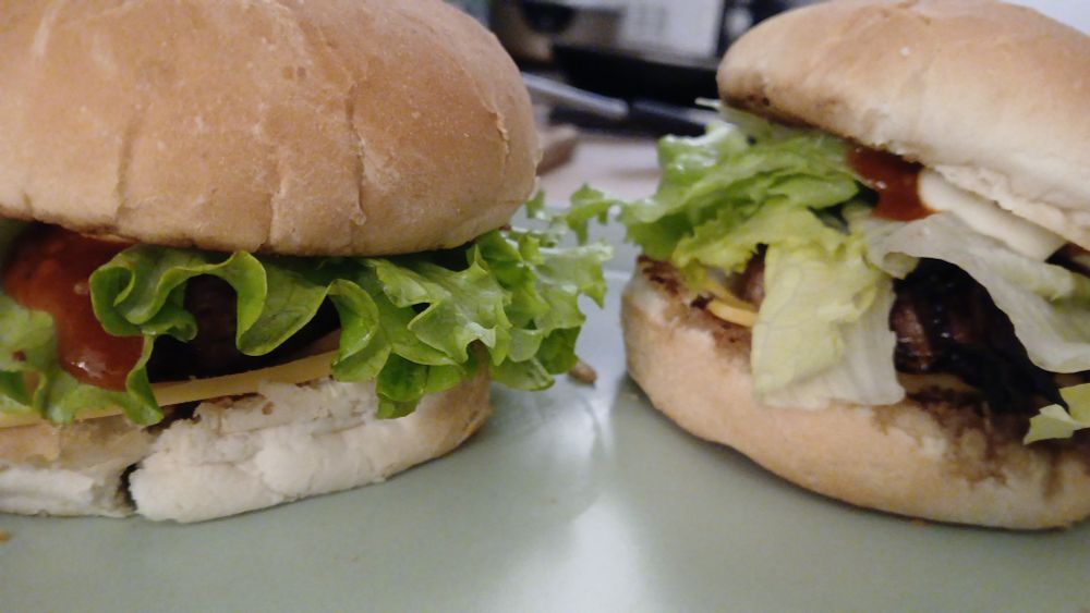 Cheese onion lettuce and beef patty burger, hot sauce and mayo included