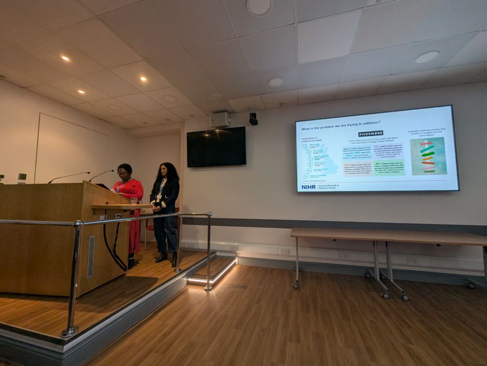 Two women presenting at a conference