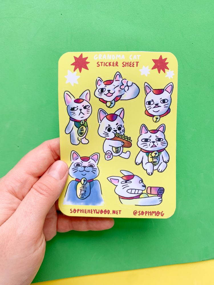Sticker sheet with lots of grumpy and sassy maneki neko cats.