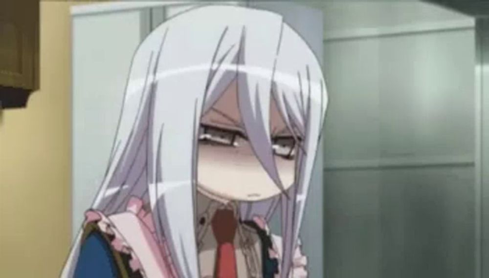 a girl with long white hair and glasses is making a funny face in a room .