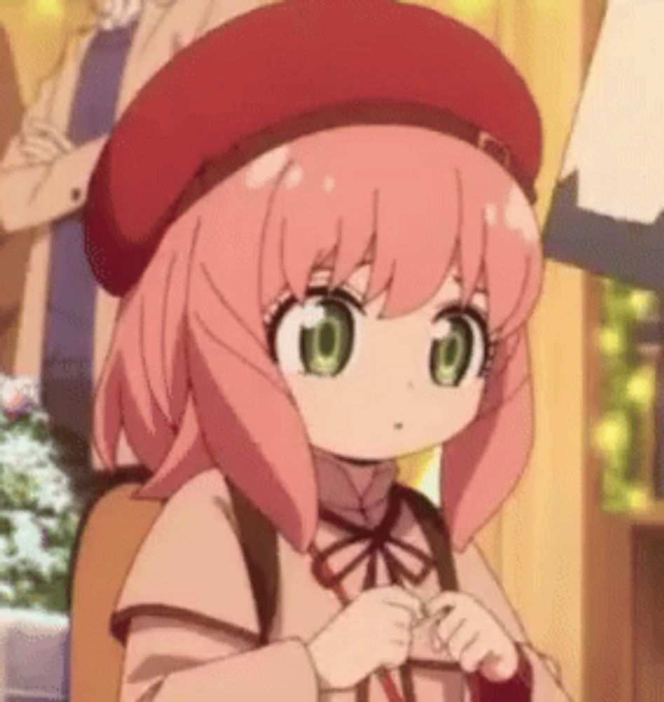 a little girl with pink hair and green eyes is wearing a red hat and a backpack .