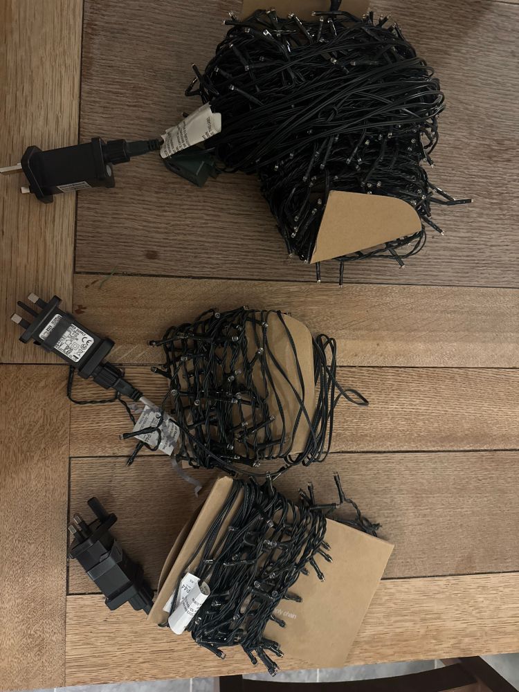 Christmas lights all sorted and wound round bits of cardboard, ready for reusing 