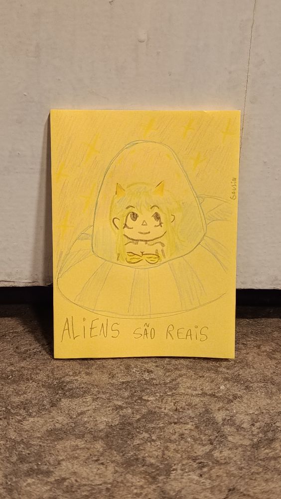 foto de um desenho feito em post-it de personagem de cabelo verde dentro de um disco voador. texto: Aliens são reais