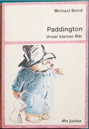 Ein Bild der dtv-junior Taschenbuchausgabe von "Paddington - Unser kleiner Bär" geschrieben von Michael Bond