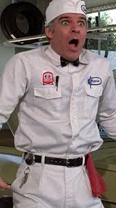 A movie frame from The Jerk.  Steve Martin is dressed as an old-timey gas station attendant with a shocked look on his face.

In the actual movie he's yelling "HE HATES THE CANS!  GET AWAY FROM THE CANS!"