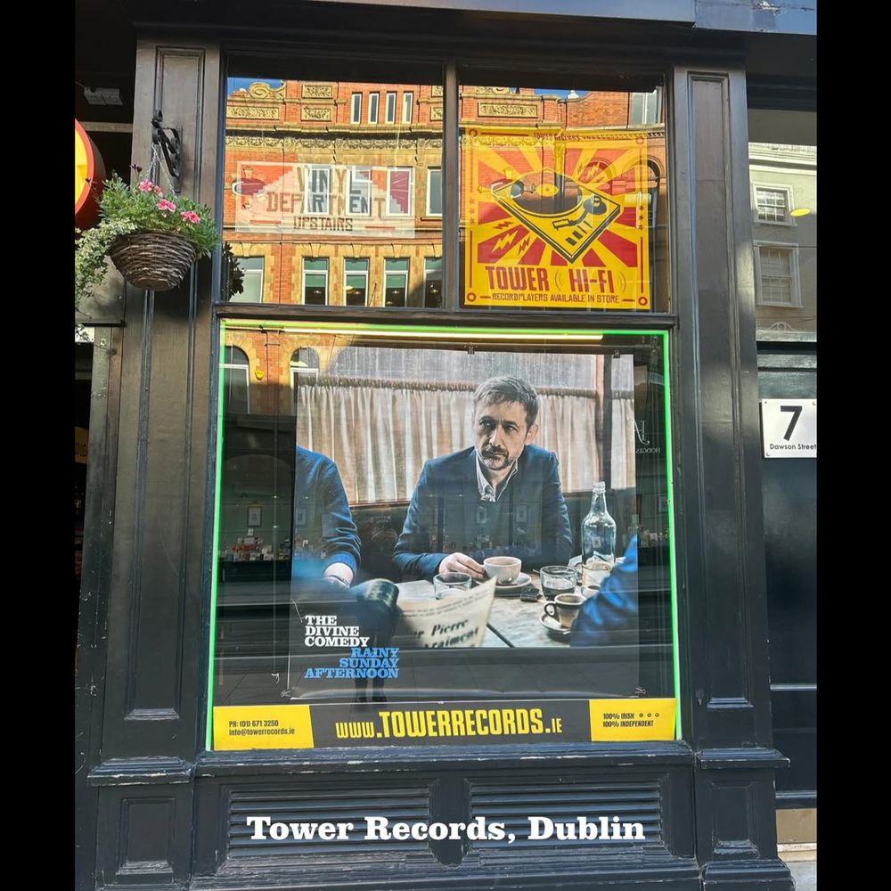 Photo showing Tower Records in Dublin with a giant Rainy Sunday Afternoon poster in the window. Photo from Dave at Gilded Alm.