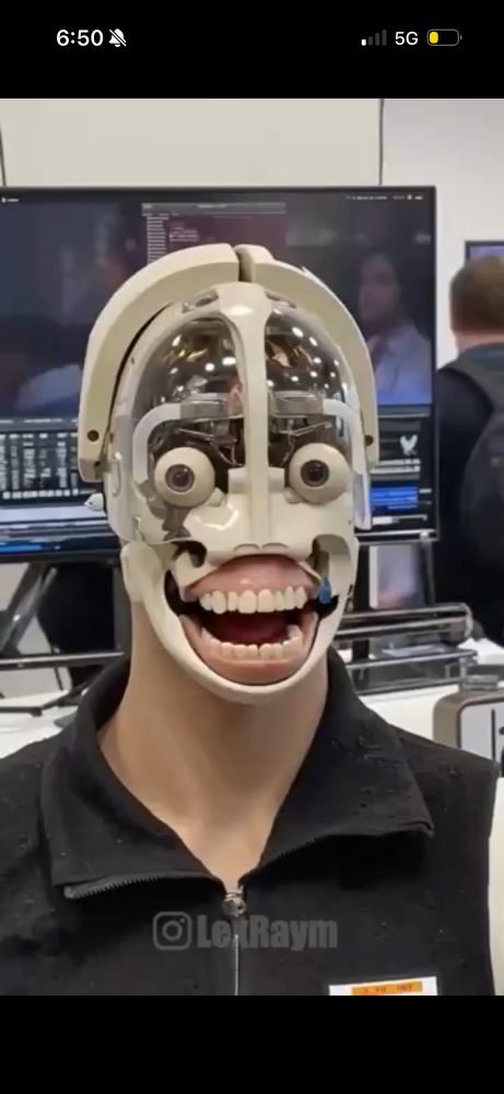 same faceless robot without wig, lipless mouth agape, cartoonishly haunting eyes 