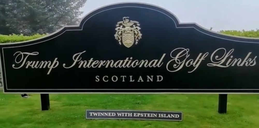 Sign for Trump International Golf Links, Scotland.

The sign has had 'Twinned with Epstein Island' added to it.