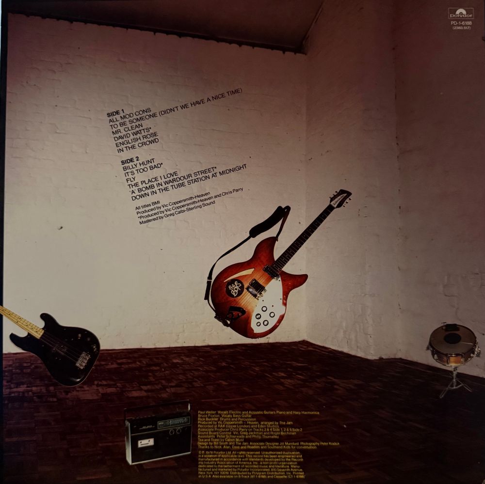 Back cover picture of band instruments
Song list and credits 