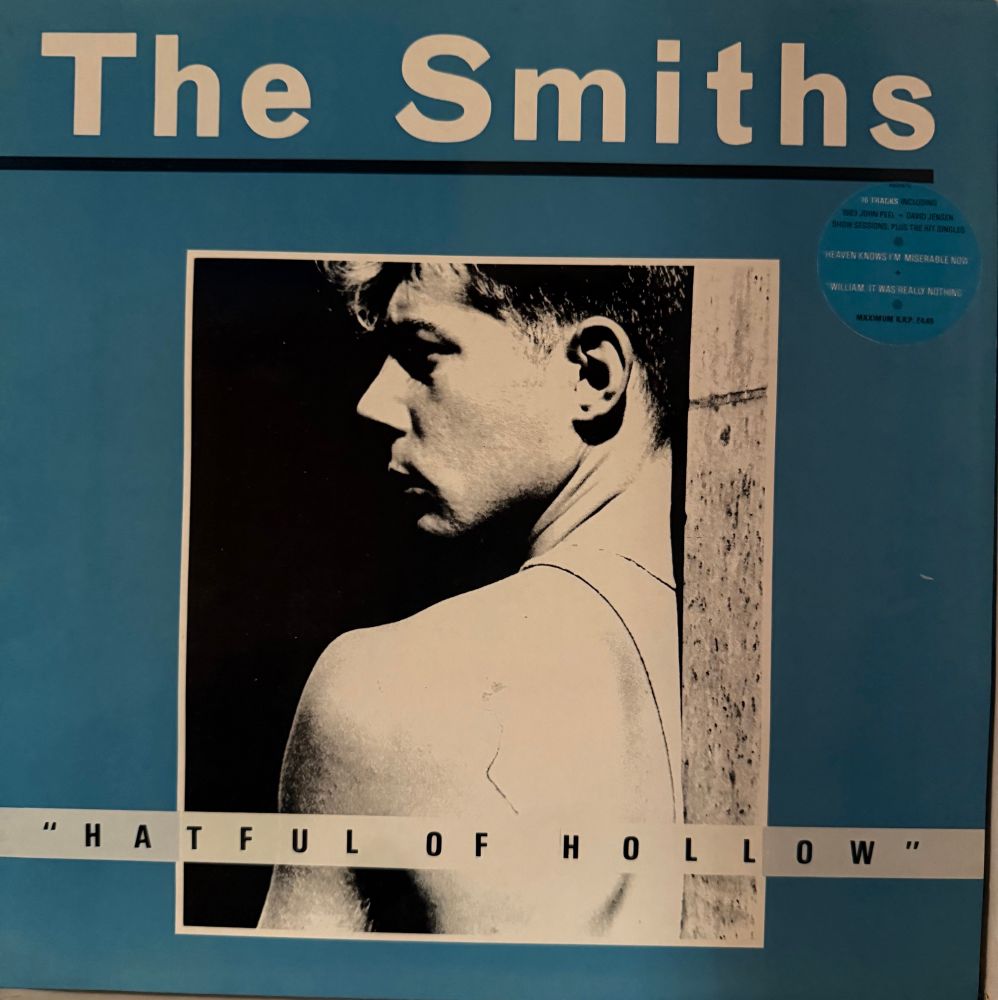 Front cover band name picture of man with Cocteau drawing tattoo title