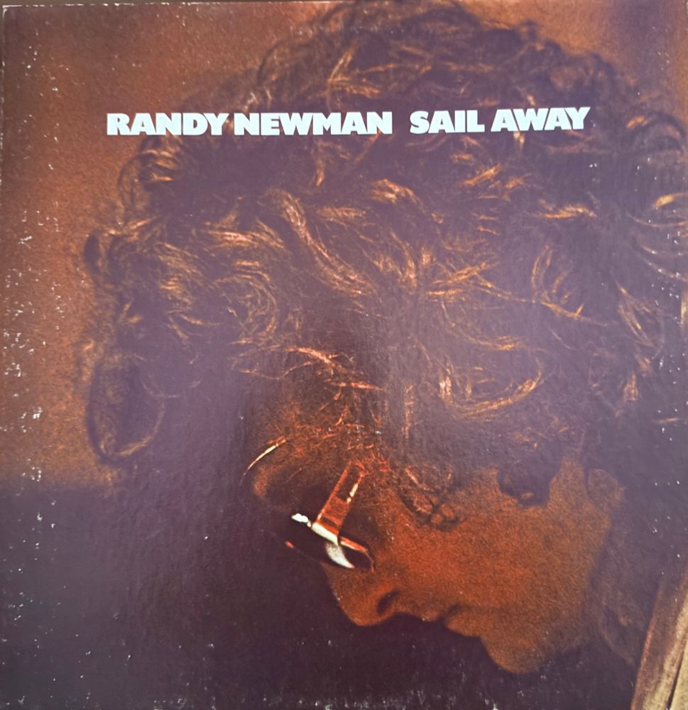 Front cover artist name and tltle over headshot of randy bowed over a keyboard