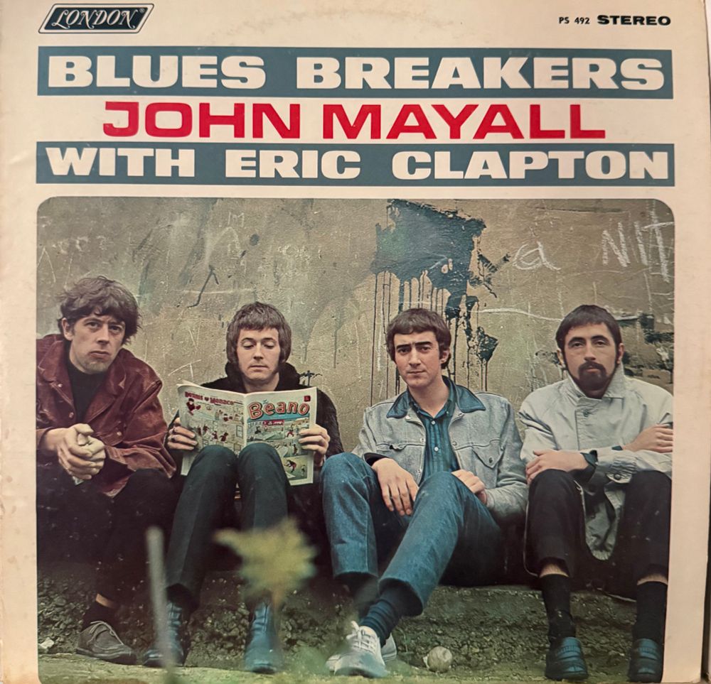 Front cover picture of band sitting under title and band name 