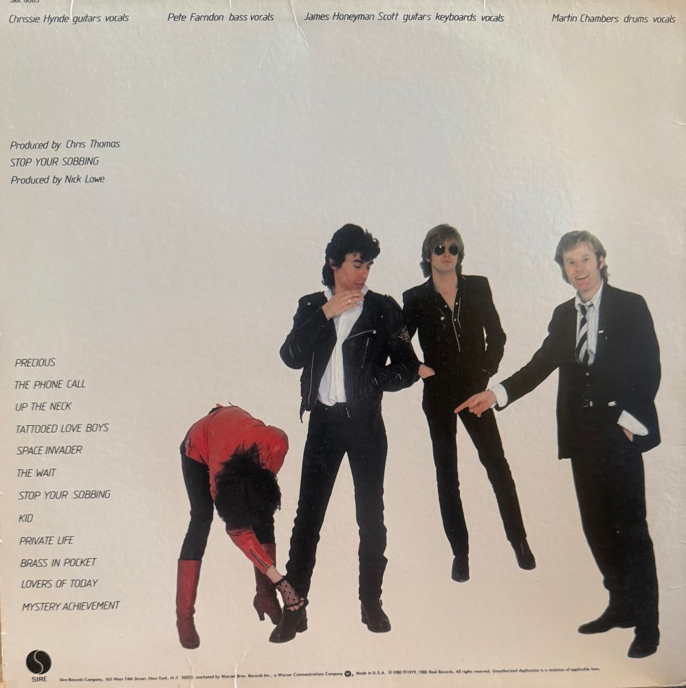 Back cover pic of band song list credits