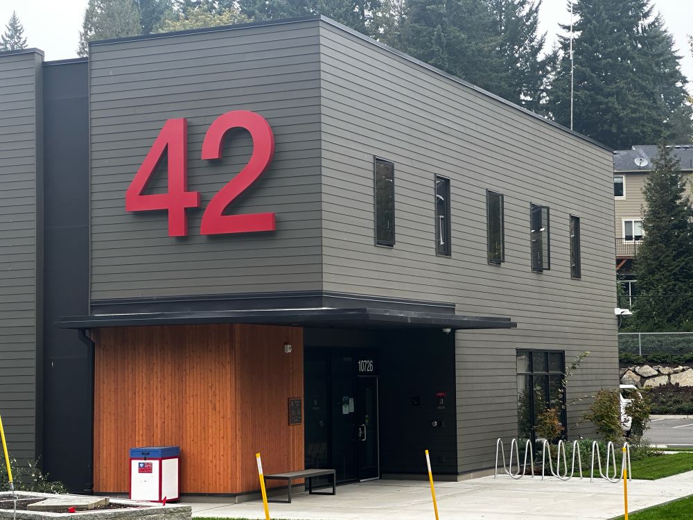 Bothell fire station 42: a dark, blocky building with big red numbers and a bike rack out front.