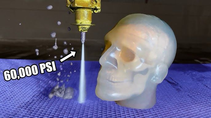 a youtube thumbnail showing a ballistic gel skull next to a water cutter jet with a big 60,000 PSI next to it