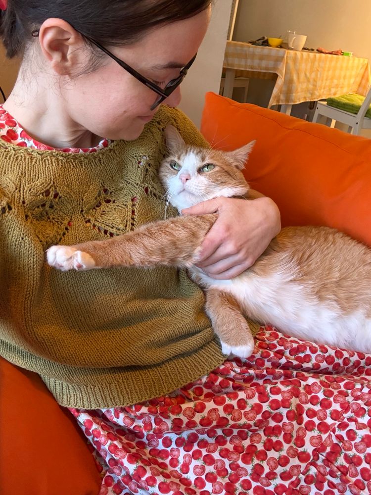 a woman and her little cat baby making deep eye contact