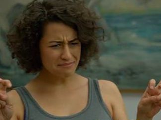 Ilana on Broad City pulling a baffled and disgusted expression while making air quotes with her hands