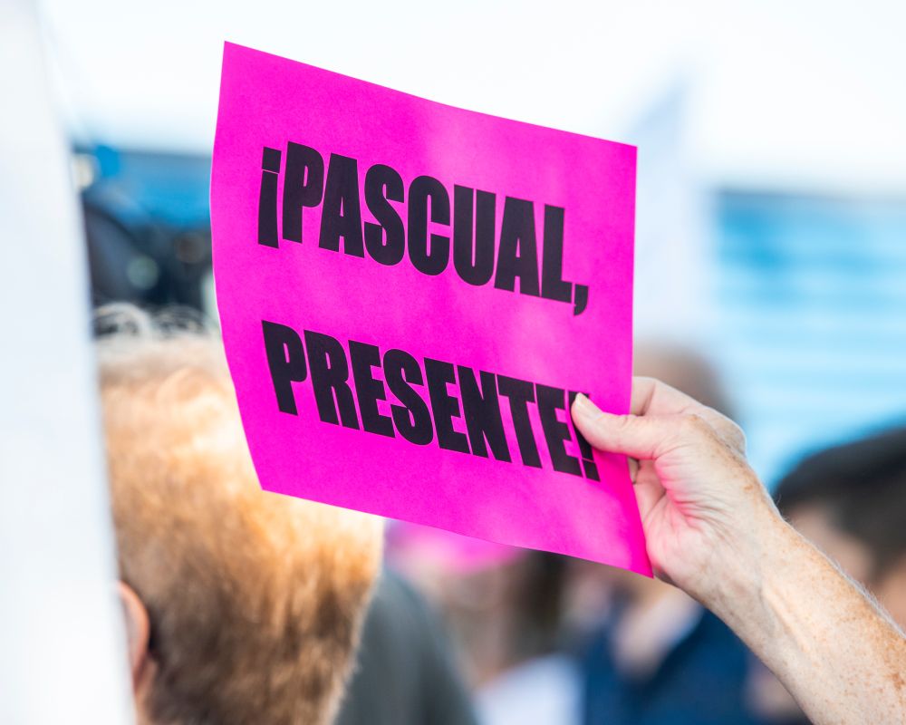 Community members hold signs during a demonstration in support of Pascual Pedro outside of the Department of Homeland Security’s office in Cedar Rapids, Iowa on Wednesday, July 9, 2025. Pedro, who had lived in Iowa for seven years after immigrating with his father at age 13, was deported to Guatemala less than a week after being detained at a required annual check-in. (Nick Rohlman/The Gazette)