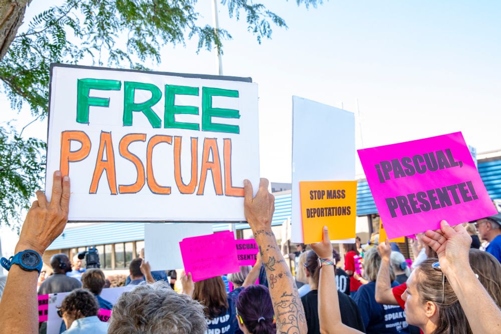 Community members hold signs during a demonstration in support of Pascual Pedro outside of the Department of Homeland Security’s office in Cedar Rapids, Iowa on Wednesday, July 9, 2025. Pedro, who had lived in Iowa for seven years after immigrating with his father at age 13, was deported to Guatemala less than a week after being detained at a required annual check-in. (Nick Rohlman/The Gazette)