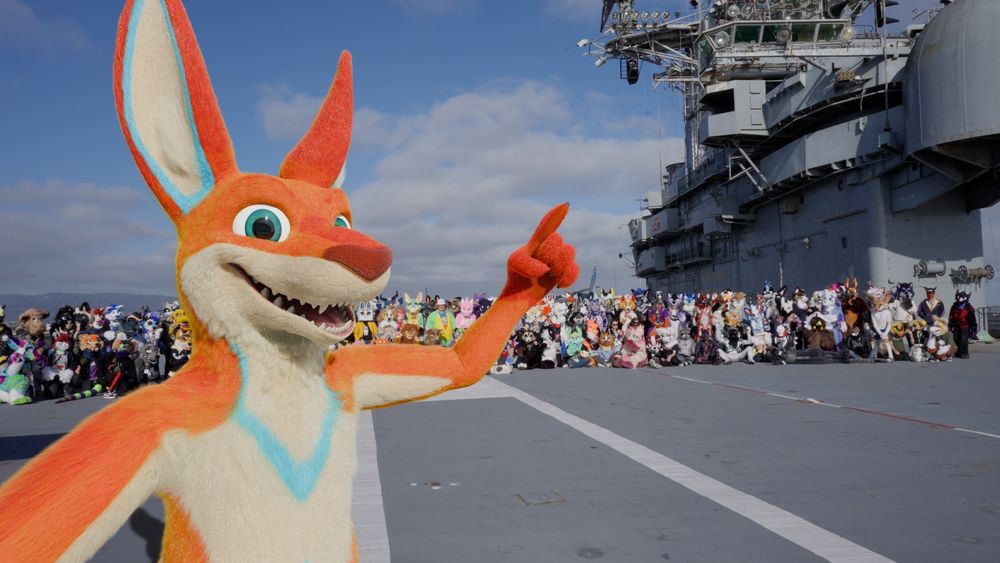 my kangaroo fursona taking a selfie on an aircraft carrier flight deck with a bunch of furries in the background