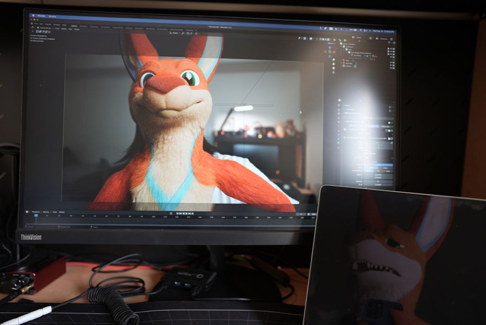 a picture of a computer screen with a blender open, showing a model of my kangaroo fursona. in the bottom right, a dark laptop screen shows my kangaroo grimacing in pain, revealing that he is the one behind the controls.
