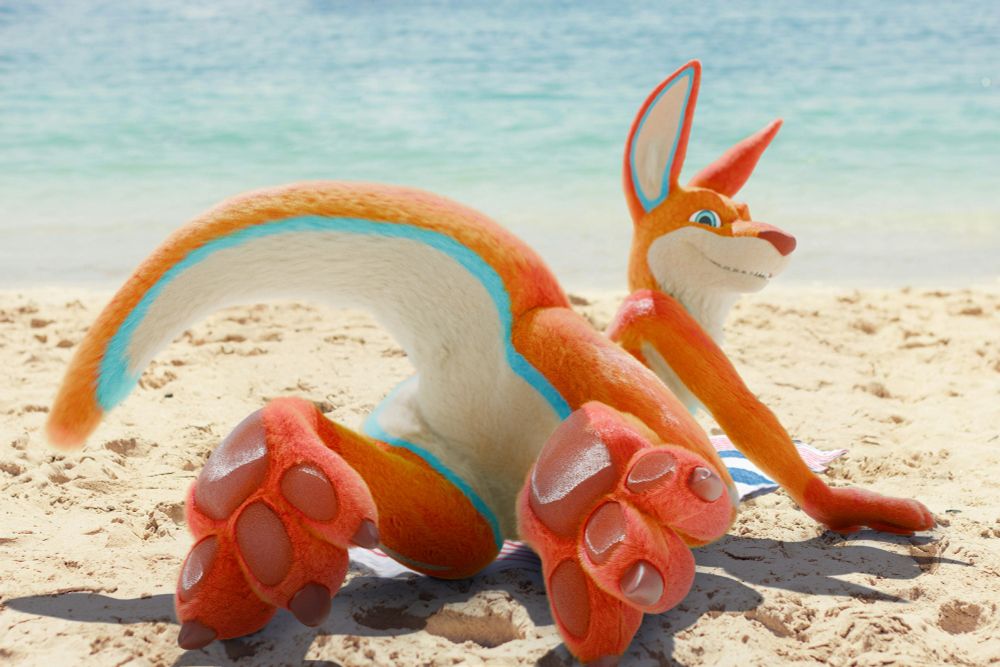 a render of a kangaroo laying chest-down on the beach with his paws conspicuously out behind him. don't drown!