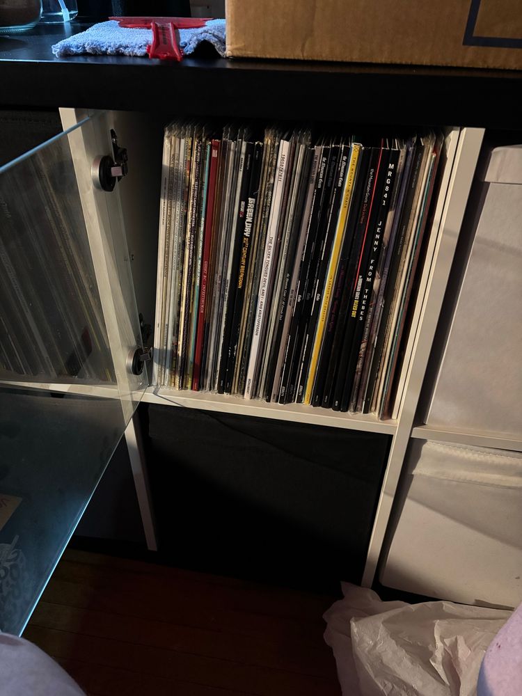 the same cube storage, but one of the boxes has been replaced by a compartment with a glass door.  the records are in it.